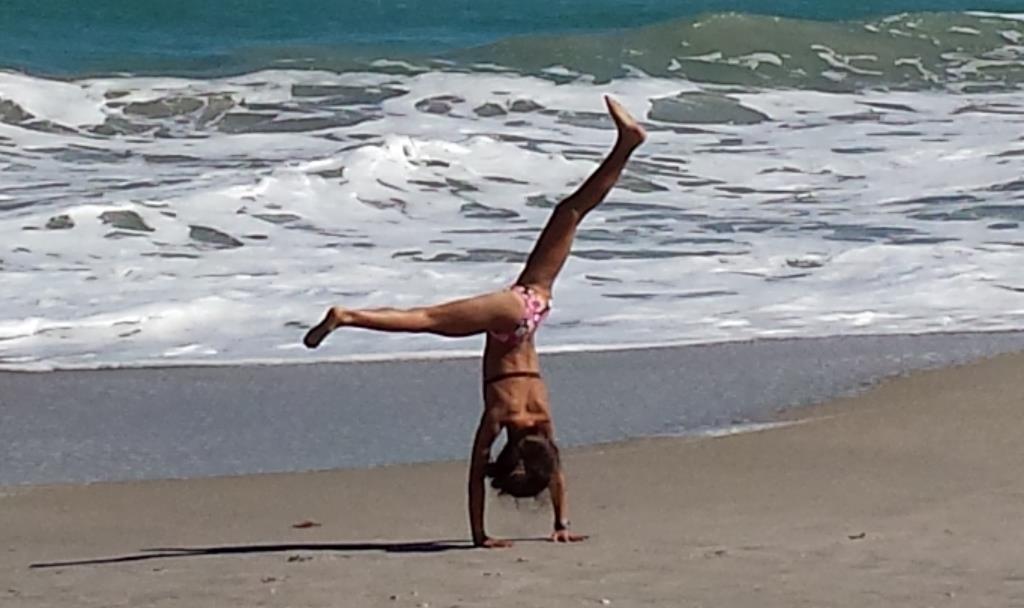 Beach girl cartwheel crop by Jenifer Joy Madden