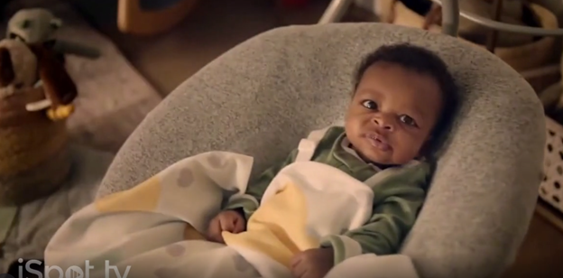 Infant in baby swing stares at camera in Dish Network Prime Video ad