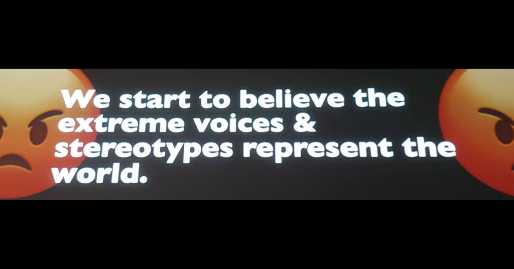 Slide from Tristan Harris talk at Wisdom 2.0 says "We start to believe the extreme voices & stereotypes represent the world."