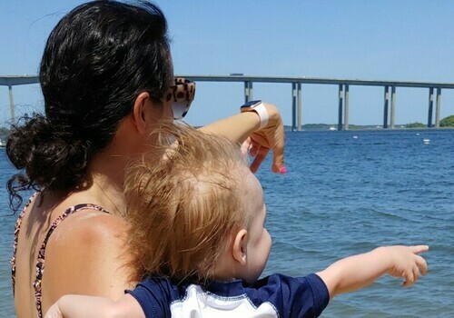 Mom and Baby Point out toward waters of a river in South Carolina, USA