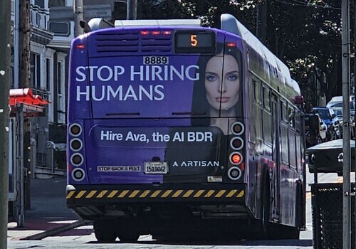 Ad on a bus in San Francisco says Stop Hiring Humans